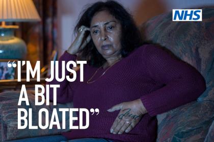 NHS campaign poster which reads ‘I’m just a bit bloated’ on an image of a woman sitting on her sofa looking concerned, with the NHS logo and text reading ‘If it last for three weeks or more just speak to your GP – Clear on cancer – help us help you’