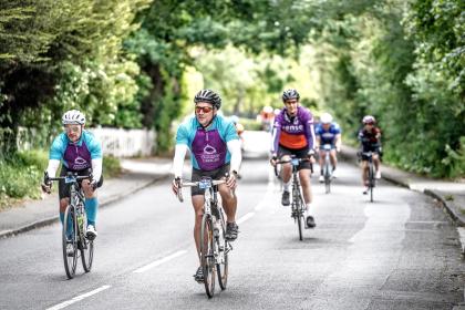 Adam Tuckwell - A Target Ovarian Cancer fundraiser on his bike with team mate at the Ride London event in June 2023 