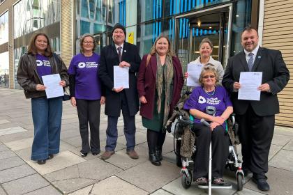 A group of Target Ovarian Cancer Campaigners, MPs and Policy team outside the Department of Health handing in a letter to the Minister.
