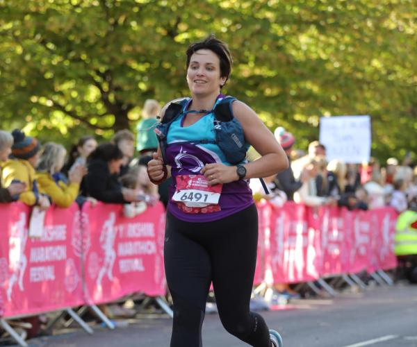 A female supporter running at Yorkshire marathon, 2023