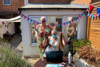 Two Target Ovarian Cancer fundraisers completing a headshave for Target Ovarian Cancer