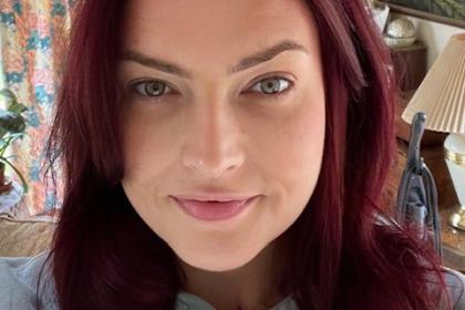 A selfie of Kate with long hair front on to camera