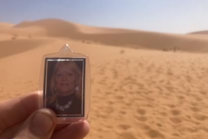A keyring with Adam's mum Jackie's photo that he is holding up in the dessert whilst doing the Marathon Des Sables