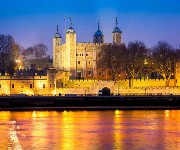 A photo of the Tower of London at nighttime