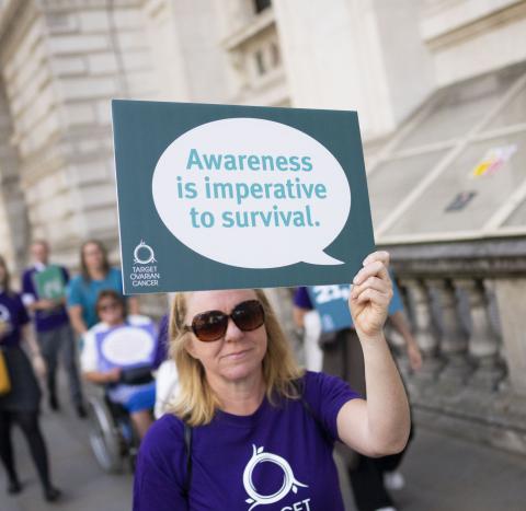 Campaigner holding placard 