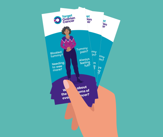 A graphic showing a hand holding the Target Ovarian Cancer symptoms awareness leaflets