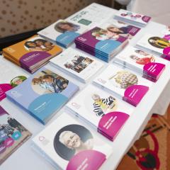 A table with information guides laid out on it
