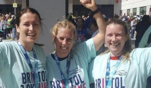 Jo Edwards and two other runners with their medals after finishing the Bristol 10K