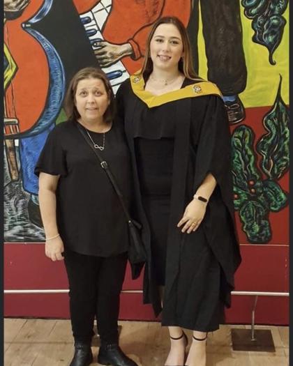 A photo of Caitlin and her mum Carol at Caitlin's graduation