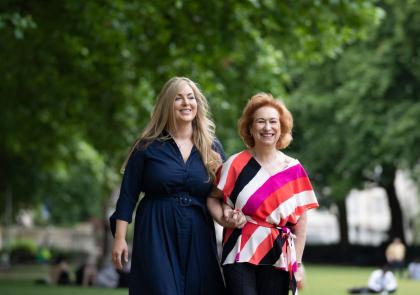 Alison walking arm in arm with another lady before entering an event at the House of Lords, London