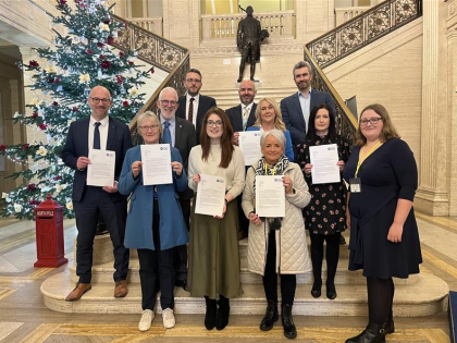 A group of people standing in Stormont including MLAs and Target Ovarian Cancer campaigners