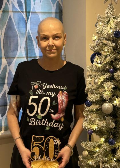 Fiona on her 50th birthday wearing a black tshirt saying it's my 50th birthday